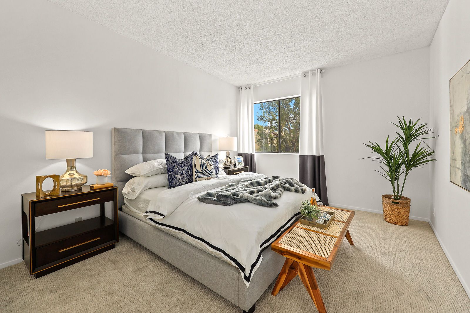 Staged bedroom with upholstered headboard - home staging