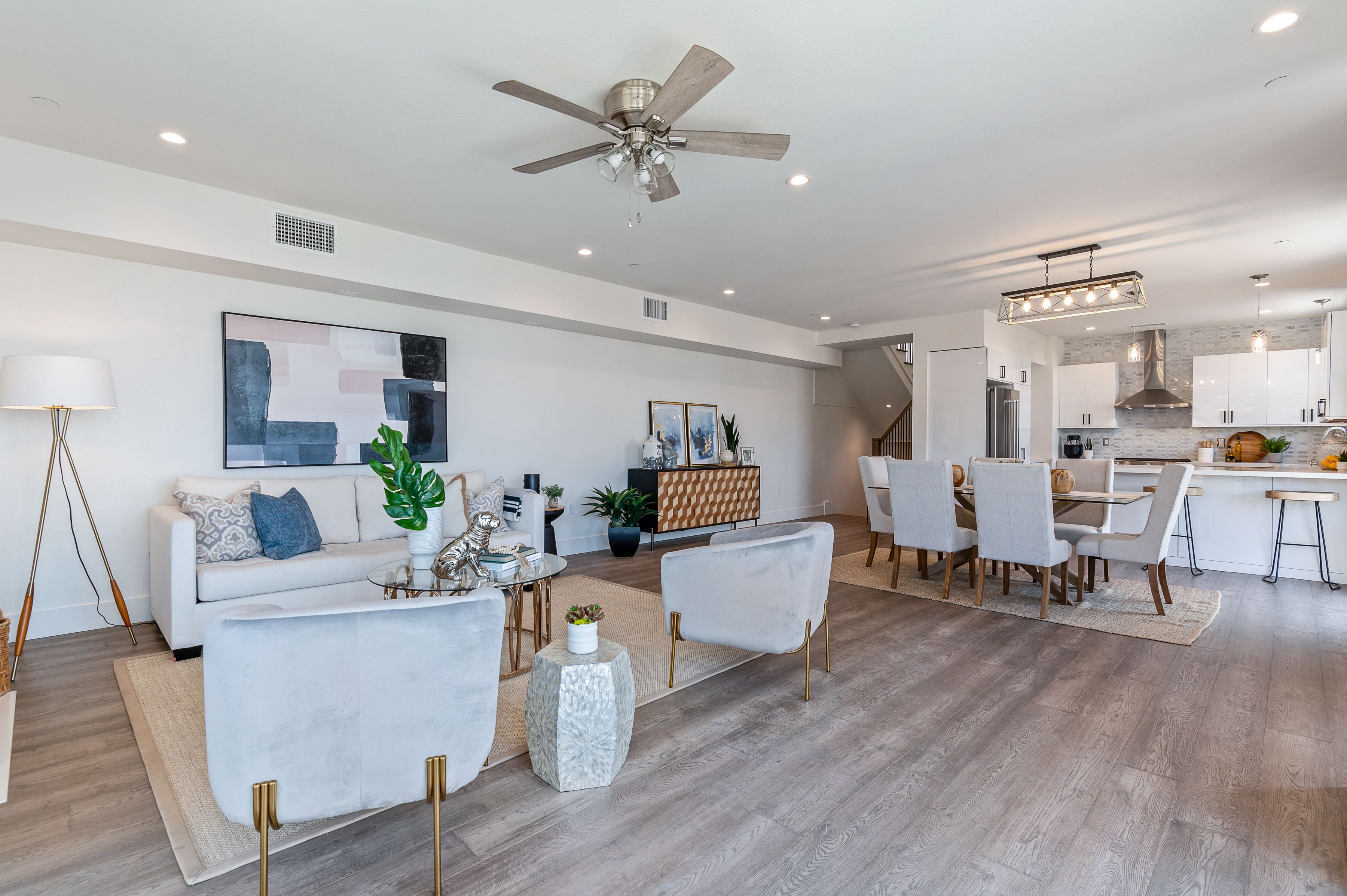 Developer staging package — new construction open-plan living, dining, and kitchen