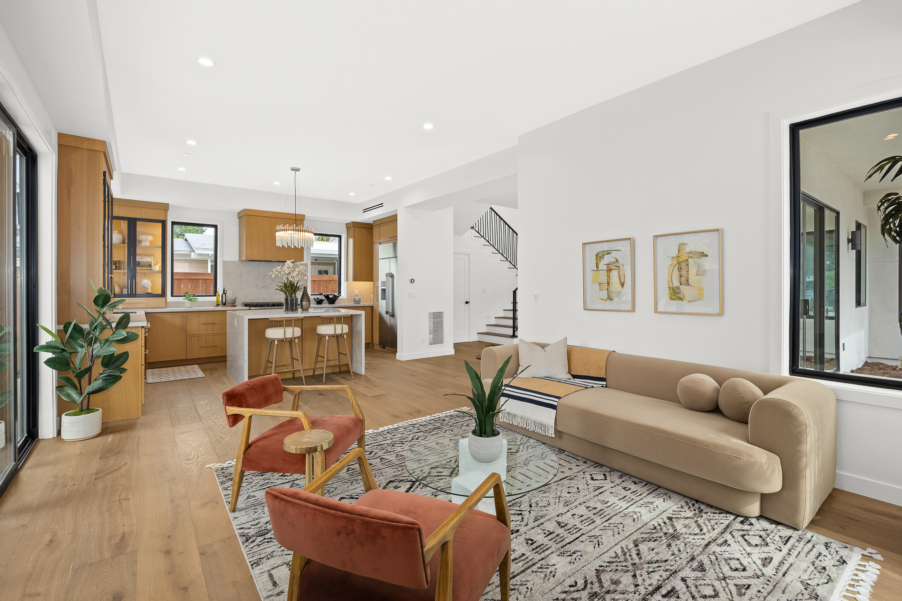 Staged living and kitchen view - new construction home staging